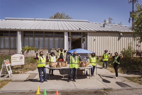 Volunteers distribute food at the Alameda Point Collaborative