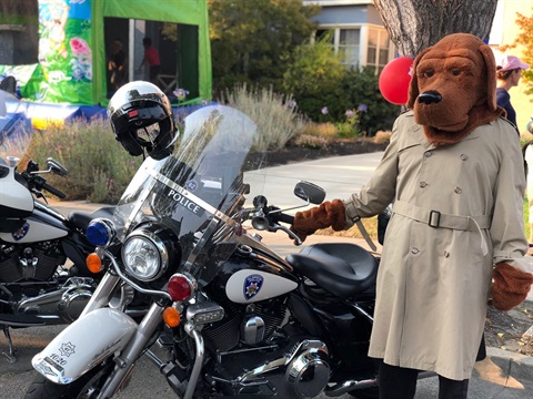 McGruff Standing By Motorcycle