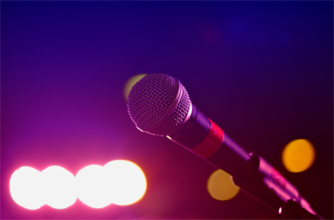 Microphone illuminated by stage lights
