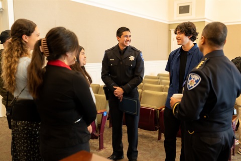 Officer Speaking With The Community 