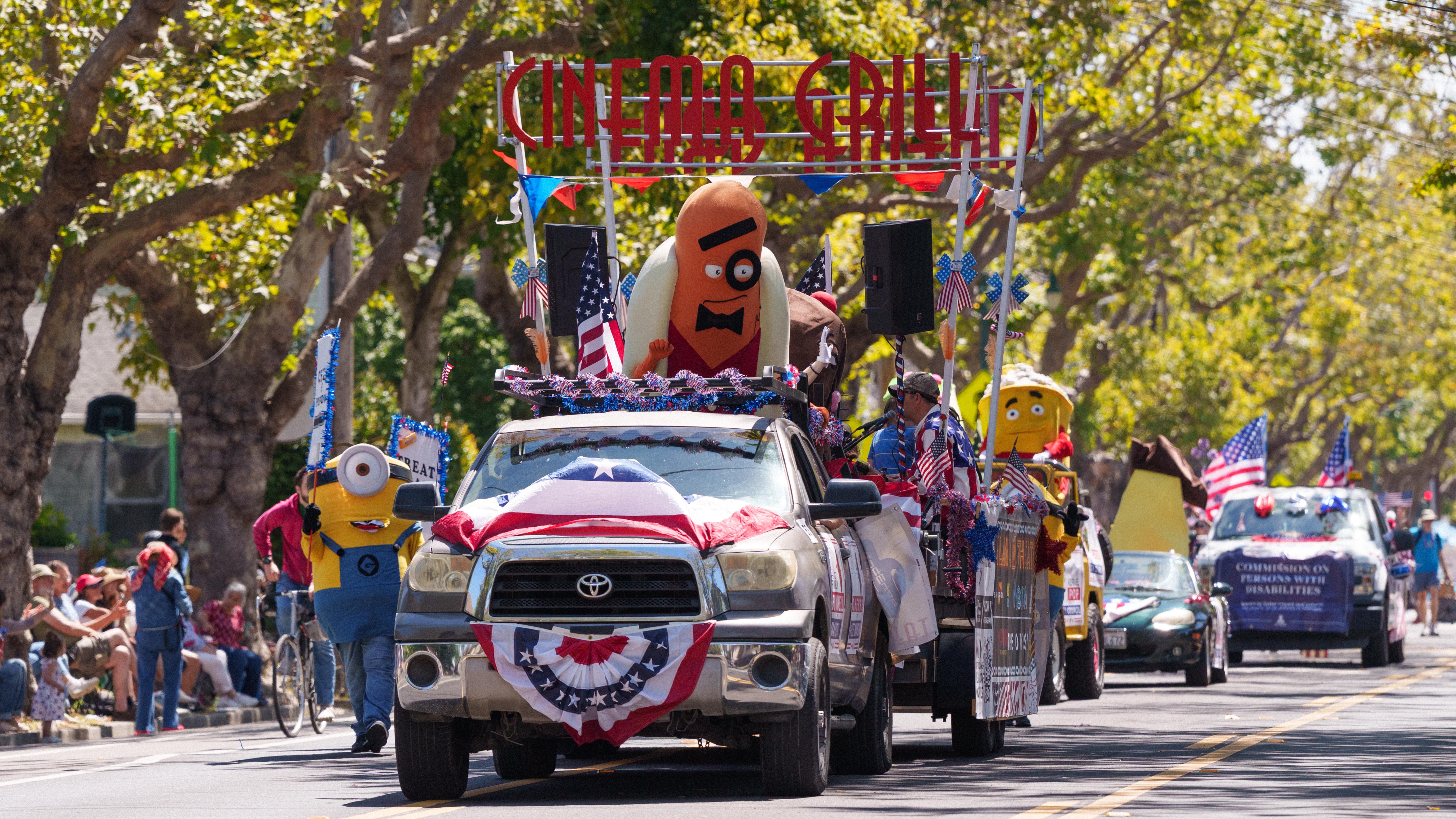 Alameda Theatre and Cinema Grill parade float the first place award winner for 2026 minions, hot dog, and other characters waving in the parade. Photo by Maurice Ramirez