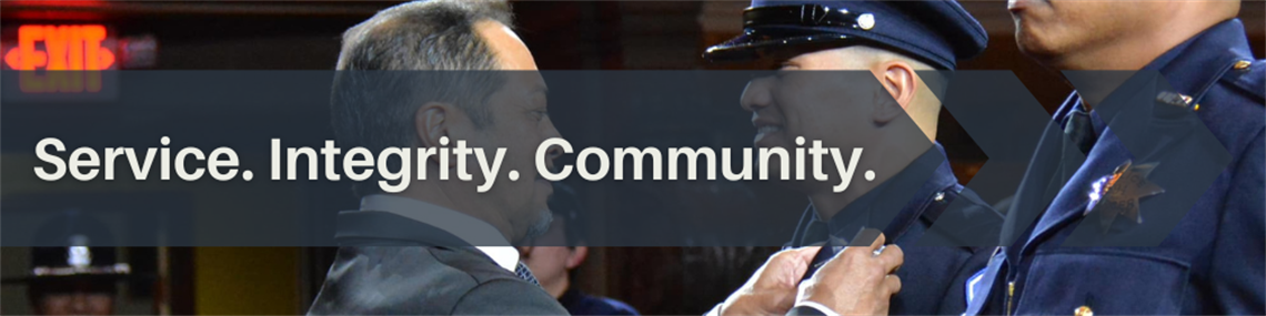 A graphic of a man pinning a badge on an officer. The image includes the words, service, integrity & community.  