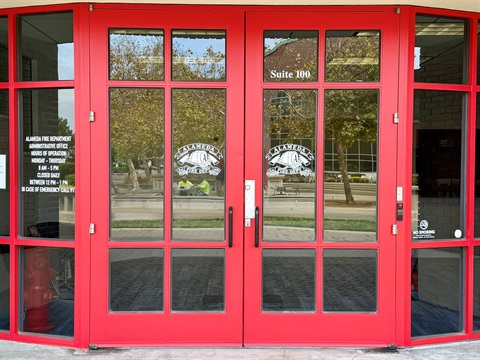 Photo of the front doors to Fire Administration with the alameda Fire logos
